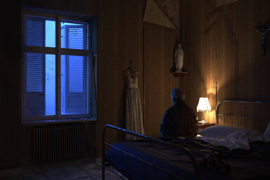 Old man in vintage bedroom