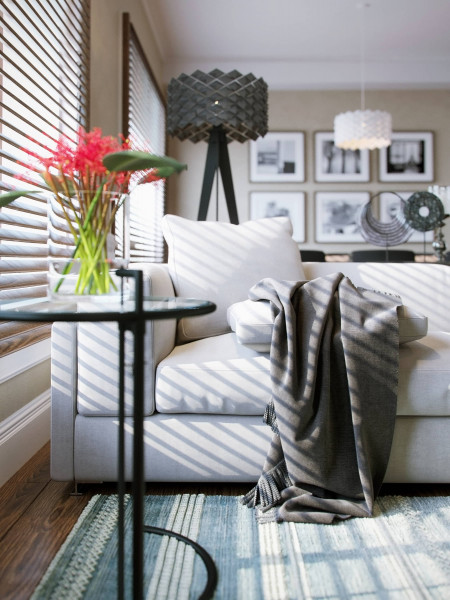 Archviz white couch with gray blanket and a table with red flowers